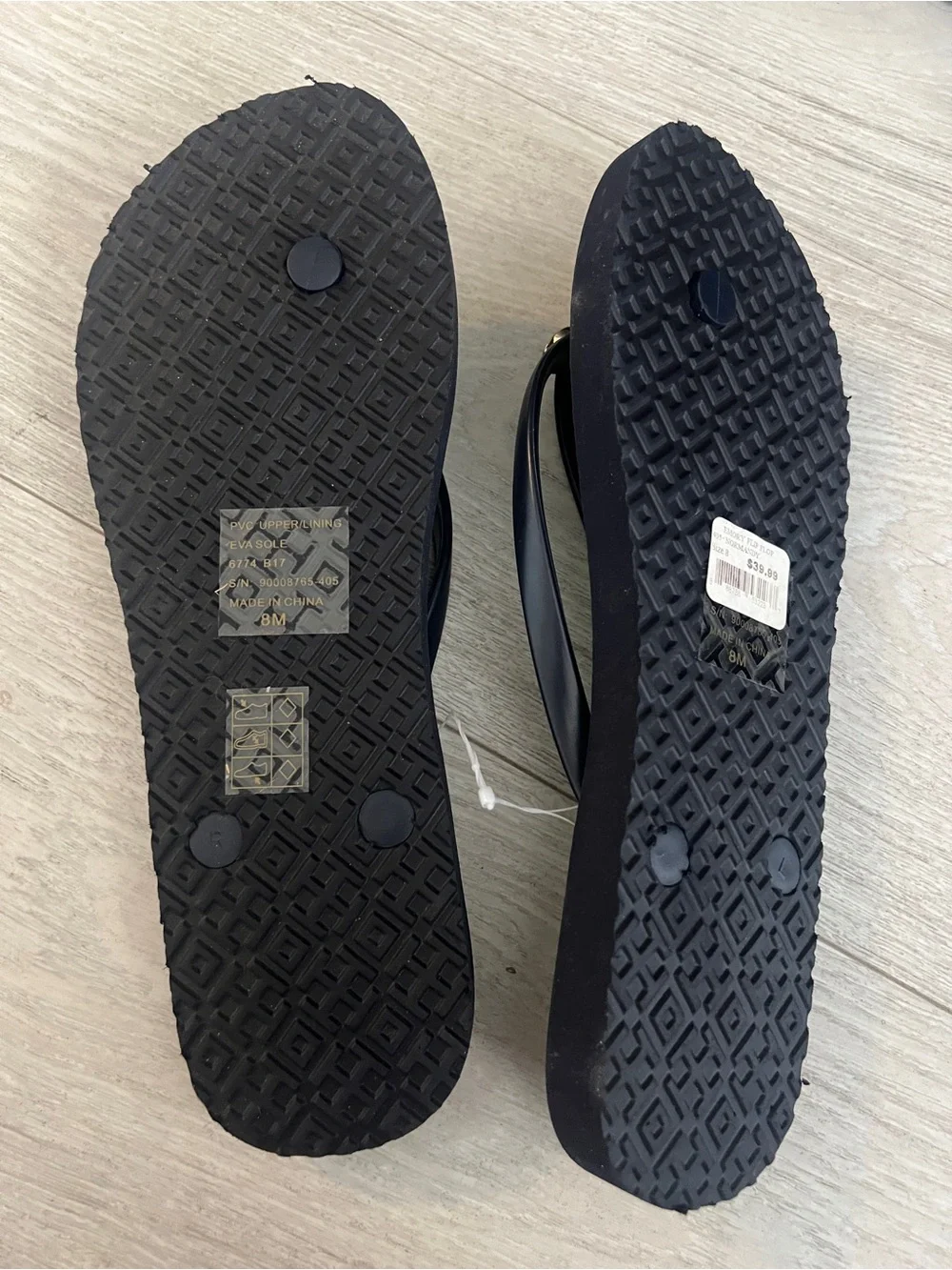 Tory Burch Black Flip Flops with Gold Logo Detail